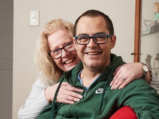 Fiona and Spiro Christopoulos pose for a picture with their dog, Hudson, 12, at their home in St Marys, after Fiona gave Spiro a kidney back in May, Monday, July 22, 2019. Picture: MATT LOXTON