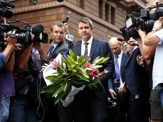 Premier Mike Baird pays his respects at the memorial in Martin Place. Picture: Bradley Hunter