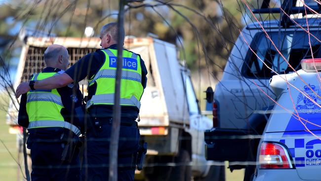 Police support each other at the property following the tragic death. Picture: Nicole Garmston