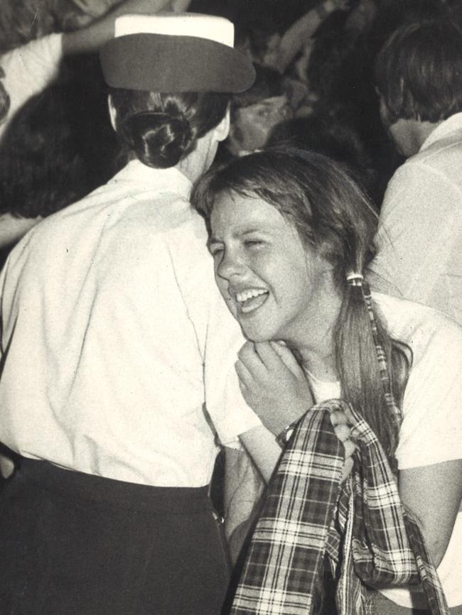 1975. A fan cries hysterically as a police officer carries her from the crush during a Bay City Rollers concert at Festival Hall, Melbourne. File picture