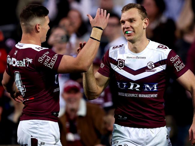 SYDNEY, AUSTRALIA - JULY 21: Tom Trbojevic of the Sea Eagles celebrates with team mate Reuben Garrick after scoring a try during the round 20 NRL match between Manly Sea Eagles and Gold Coast Titans at 4 Pines Park, on July 21, 2024, in Sydney, Australia. (Photo by Brendon Thorne/Getty Images)