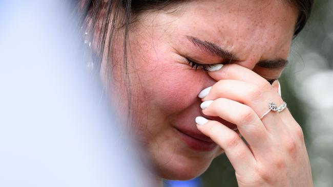 A young Israeli woman grieves at the joint funerals of Dana and Carmel Becher, a mother and son who were killed by Hamas. Picture: Leon Neal/Getty Images