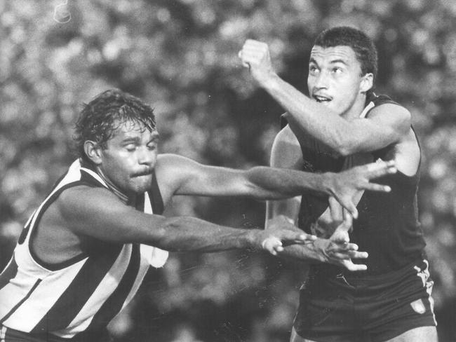 North Darwin's Tim Dudley tackles Nightcliff's Ingvar Dyrting during an NTFL match held at Gardens Oval. Circa: No date.