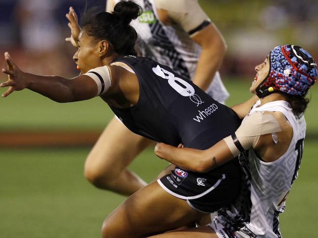 MELBOURNE, AUSTRALIA - JANUARY 28: Aliesha Newman of Collingwood performs a dangerous tackle on Vaomua Laloifi of Carlton during the round one AFLW match between the Carlton Blues and the Collingwood Magpies at Ikon Park on January 28, 2021 in Melbourne, Australia. (Photo by Darrian Traynor/Getty Images)