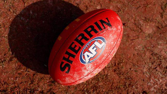 MELBOURNE, AUSTRALIA - MAY 05: A red Sherrin football is seen during the 2024 AFL Round 08 match between the Richmond Tigers and the Fremantle Dockers at The Melbourne Cricket Ground on May 05, 2024 in Melbourne, Australia. (Photo by Michael Willson/AFL Photos via Getty Images)