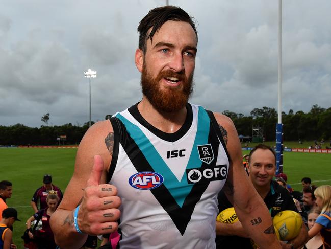 Charlie Dixon of the Power celebrates with fans after winning the AFL Marsh Community Series pre-season match between the Brisbane Lions and the Port Adelaide Power at the Moreton Bay Central Sports Complex in Burpengary, Queensland, Sunday, February 23, 2020. (AAP Image/Darren England) NO ARCHIVING, EDITORIAL USE ONLY