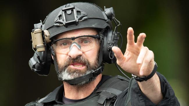 An AOS (Armed Offenders Squad) member is seen following a shooting at the Masjid Al Noor mosque in Christchurch, New Zealand, Friday, March 15, 2019. Multiple people have been killed after a gunman opened fire at two mosques in the New Zealand city of Christchurch. (AAP Image/SNPA, Martin Hunter) NO ARCHIVING