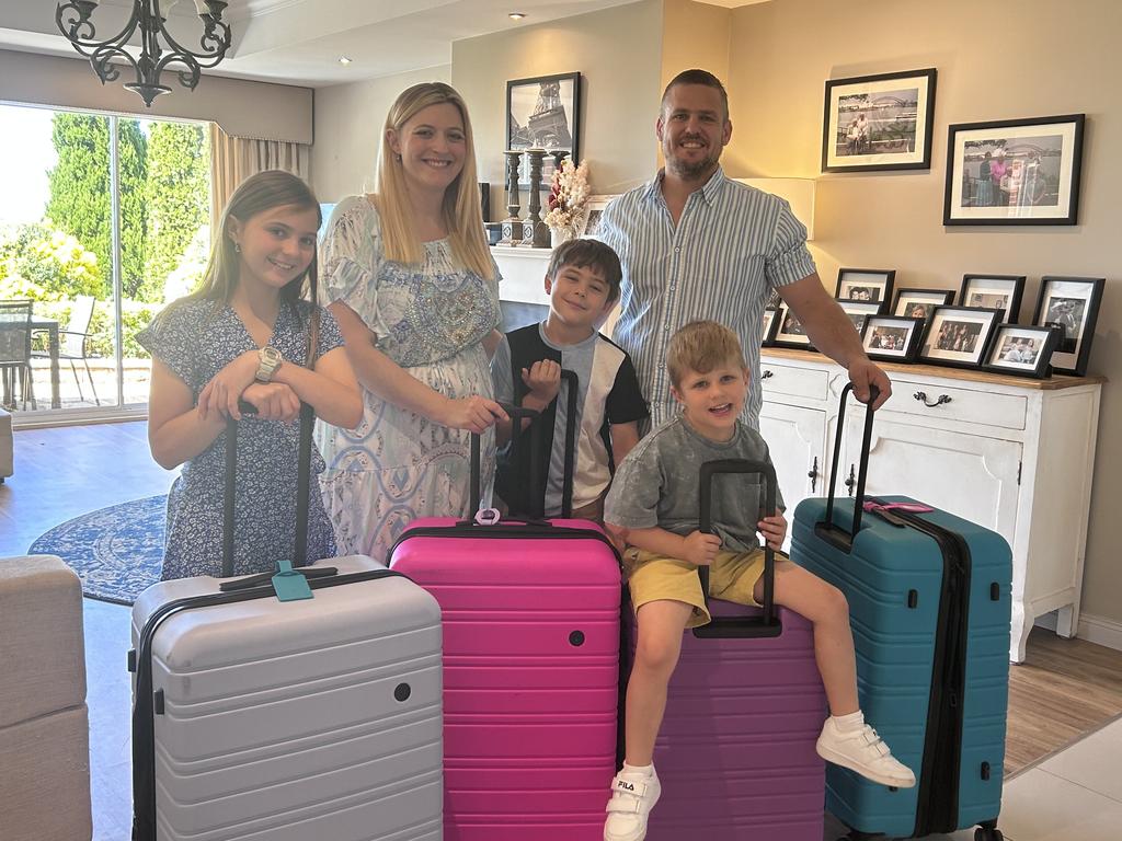 Julia and Josh Brown, with their three children ages 12, 9 and five.