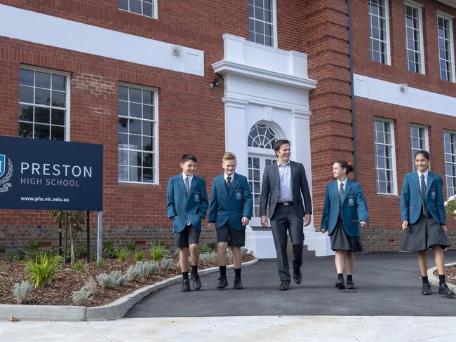 Year 7 students Jack, Thomas, Lili and Beth with principal Sean Butler at brand-new Preston High on opening day. Picture: Andy Brownbill