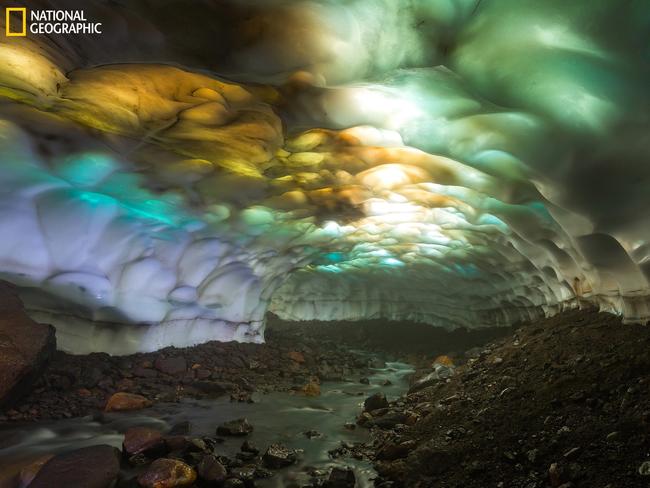 Aladdin's Cave ... Snow cave on the slopes of the volcano Mutnovsky. Due to of global warming, glaciers have begun to decline. As a result, the ceiling of the cave became thin and the sunlight creates a wonderful picture of the different colors. Picture: Denis Budkov/2016 National Geographic Nature Photographer of the Year