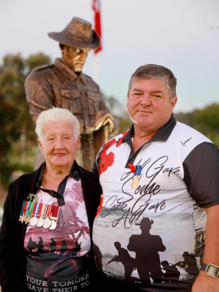 Blacktown’s Ruth Jones with her late husband Thomas Jones’ World War II medals at Anzac Day commemorations at Pinegrove Memorial Park in Minchinbury. She is pictured here with her son, Barry. Picture: Angelo Velardo