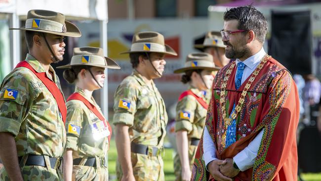 His Worship the Mayor of Alice Springs Matt Paterson inspects the Honour Guard during the Australia Day Flag Raising and citizenship ceremony at Alice Springs Town Council lawns Todd Street Alice Springs. Picture Mark Brake