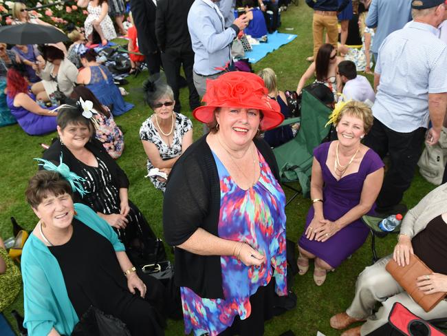 Diane Mason from Tamworth, with friends on the lawn at the 2014 Melbourne Cup. Picture: Jason Sammon