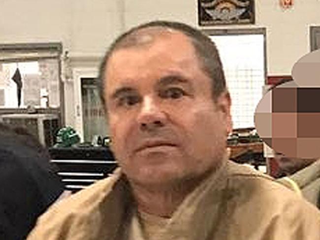 (FILES) In this file photo taken on January 19, 2017 This handout picture released by the Mexican Interior Ministry shows Joaquin Guzman Loera aka "El Chapo" Guzman (C) escorted in Ciudad Juarez by the Mexican police as he is extradited to the United States. - Joaquin "El Chapo" Guzman goes on trial in New York on Monday, accused of running the world's biggest drug cartel and spending a quarter of a century smuggling more than 155 tons of cocaine into the United States. (Photo by HO / INTERIOR MINISTRY OF MEXICO / AFP) / RESTRICTED TO EDITORIAL USE-MANDATORY CREDIT "AFP PHOTO/INTERIOR MINISTRY OF MEXICO" NO MARKETING NO ADVERTISING CAMPAIGNS-DISTRIBUTED AS A SERVICE TO CLIENTS-XGTY