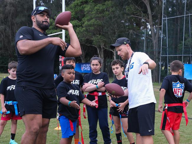 Australian NFL Player Jordan Mailata with aspiring kids during an NFL Flag Football Clinic in Sydney. Picture: Daily Telegraph / Gaye Gerard