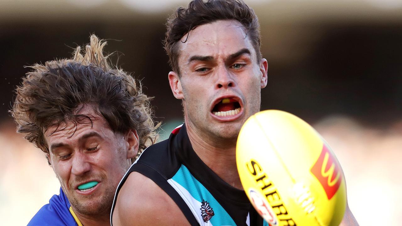 Port Adelaide’s Karl Amon and Connor West of the West Coast Eagles during their round 6 clash in April. Picture: Sarah Reed/AFL Photos via Getty Images