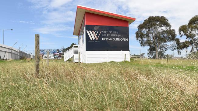 The sales office sits closed on the vacant site. Picture: Lawrence Pinder