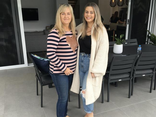 Cricketer Mitchell Swepson’s mother Kylie Swepson and fiance Jess Thorpe celebrating their new home in Dorrigo Street, Stafford Heights.