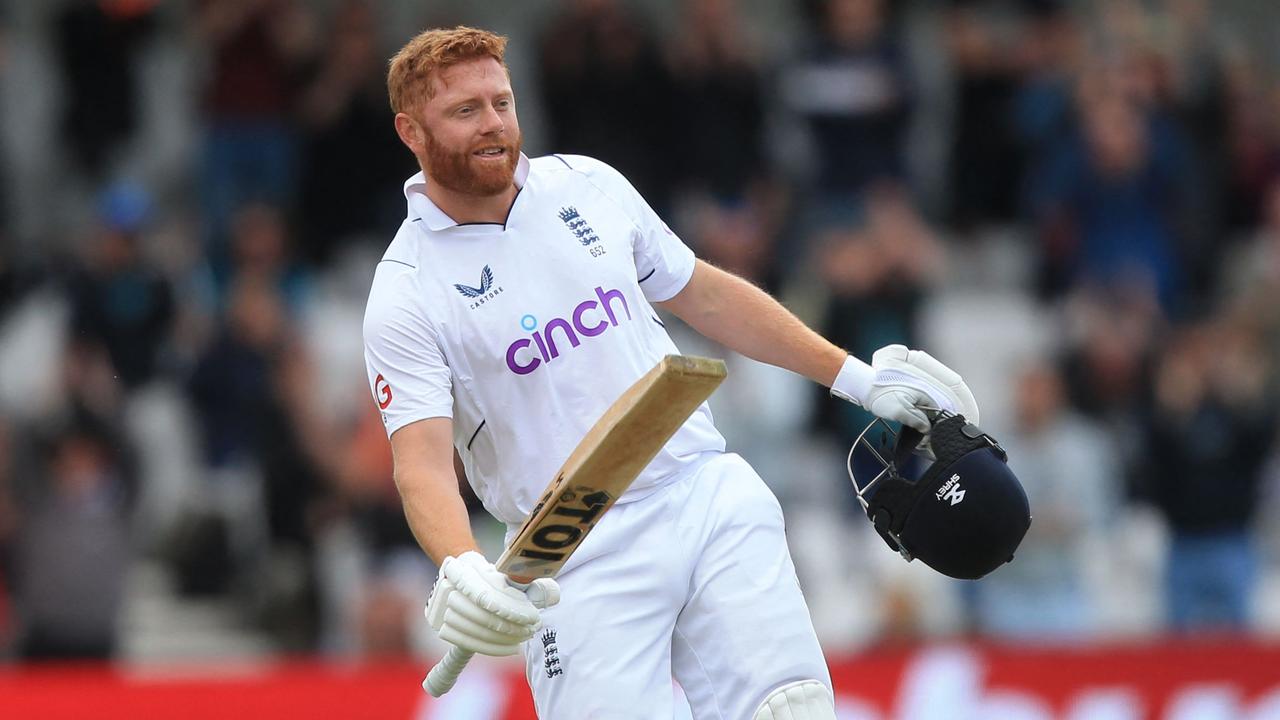 England's Jonny Bairstow celebrates after hitting a six. Photo by Lindsey Parnaby / AFP