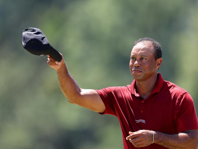 Tiger Woods waves his hat at the crowd after finishing 16-over. Picture: Getty