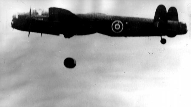 05/1943. RAF Lancaster bomber dropping bomb over Ruhr Valley during famous Dambuster Operation, special round bomb capable of bouncing along water designed by Sir Barnes Wallis. Camera Press Agency photo Ref No : 25359-2 (37).  England / Armed Forces / Royal Air Force / Aircraft / Dambusters / World War Two (II)  Historical