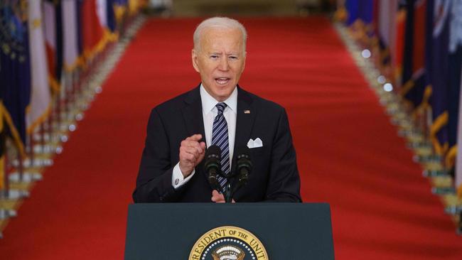 US President Joe Biden gestures as he speaks on the anniversary of the start of the COVID-19 pandemic. Picture: AFP