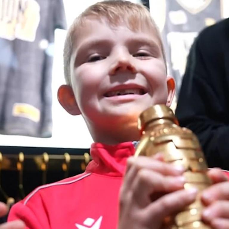 The boy with his solid gold prize. Picture: X