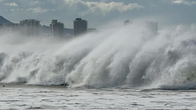 Swimmers and surfers were making the most of the big swell at Mooloolaba on Monday afternoon ahead of Tropical Cyclone Alfred crossing the Qld coast. Photo: Mark Furler