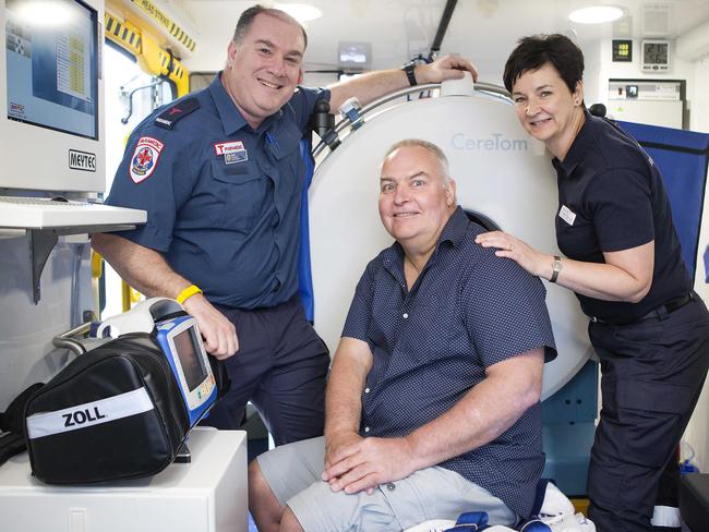 Paramedic, Rob Simons, stroke survivor, Iain Sim and radiographer Francesca Langenberg inside the new Ambulance.