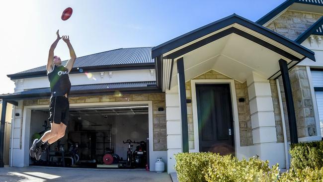 Georgiades practices his high flying while quarantining at Port Adelaide teammate Travis Boak’s home. Picture: Roy Van Der Vegt