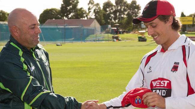 Darren Lehmann presents his son, Jake, with his first South Australian Sheffield Shield cap in 2015.