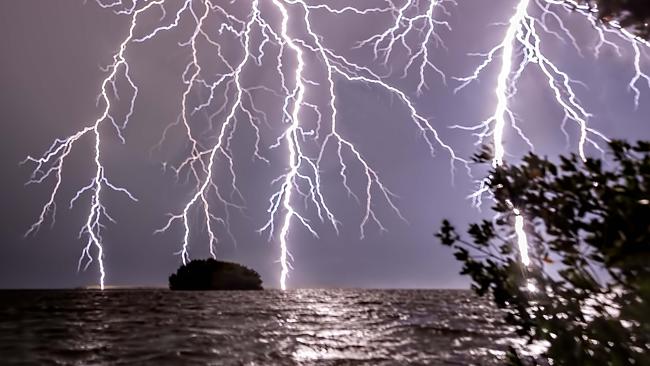 Kayaker caught in mega storm captures breathtaking photos of lightning  hitting the water  — Australia's leading news site