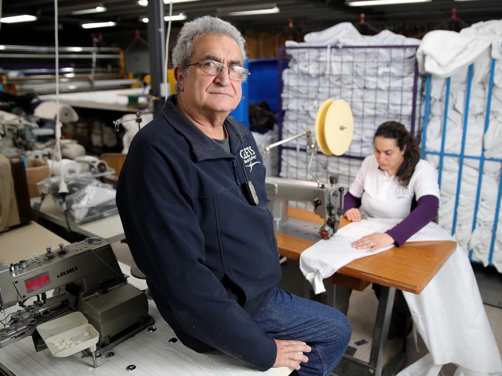 23/04/2020: Owner Sandy Pachos with his daughter & Factory Manager Lisa Pachos, using their ultrasonic welding machine, to make disposable medical gowns, to help stop infections from the Coronavirus. Stuart McEvoy/The Australian.