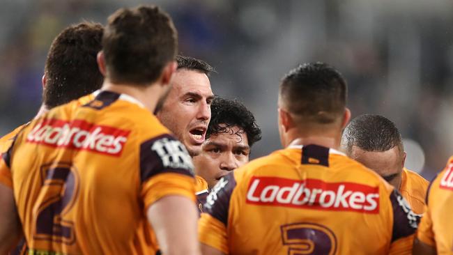 Darius Boyd reads the riot act to the Broncos players.