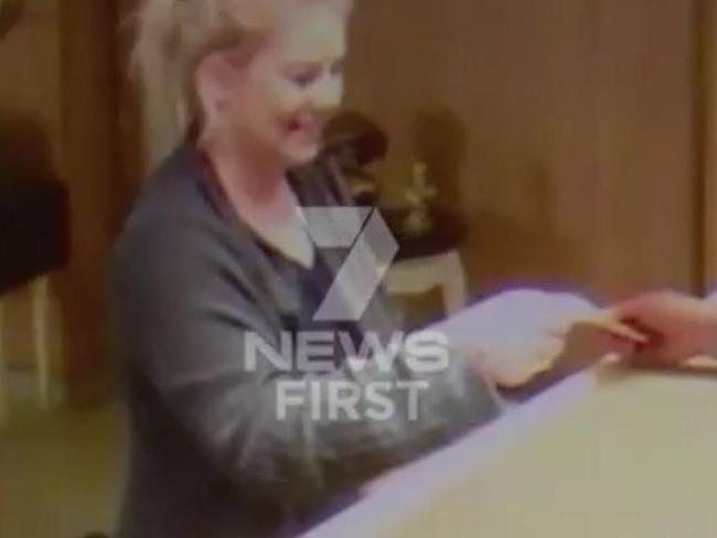 Sainsbury prepares to leave her hotel. Picture: Channel 7