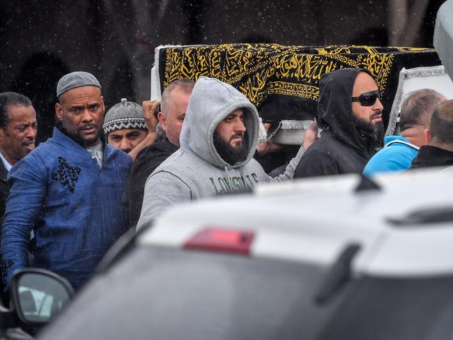 The body of Omar Moujalled is carried by loved ones outside Meadow Heights Mosque. Picture: Jake Nowakowski