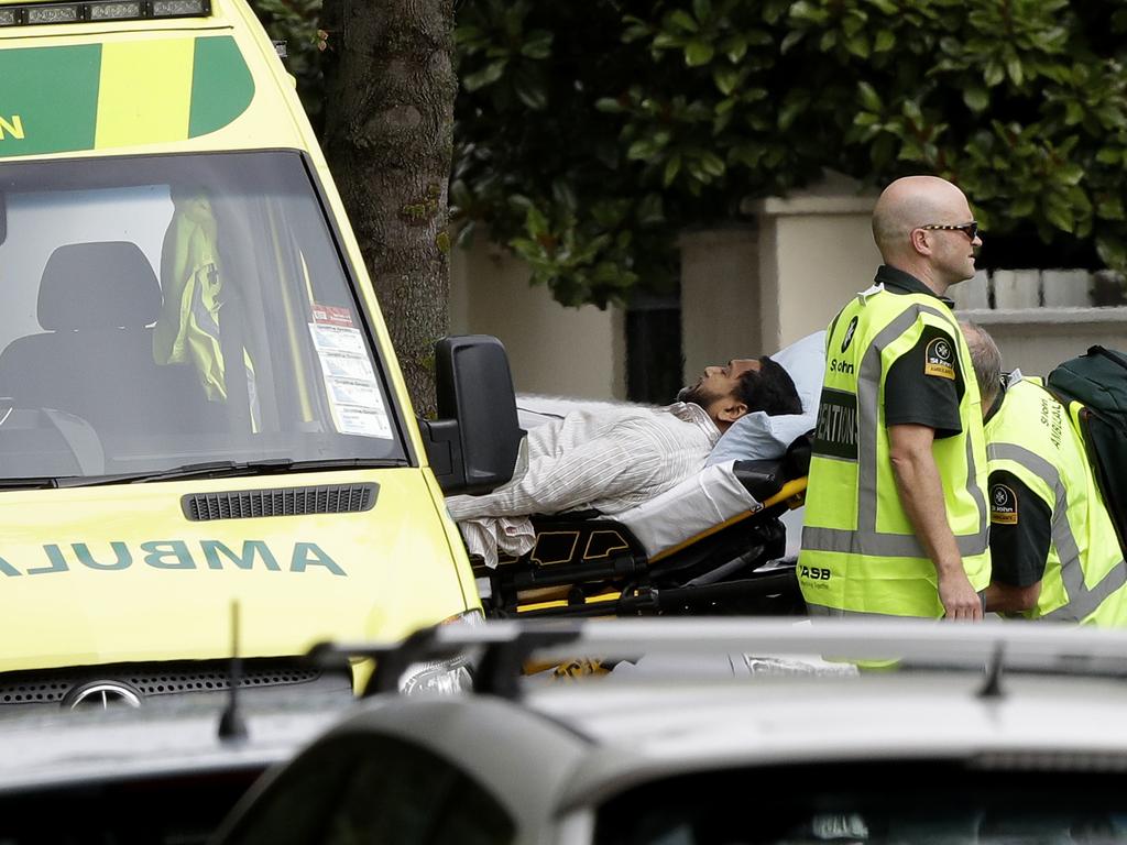 Ambulance staff take a man from outside a mosque in central Christchurch, New Zealand, Friday, March 15, 2019. (AP Photo/Mark Baker)