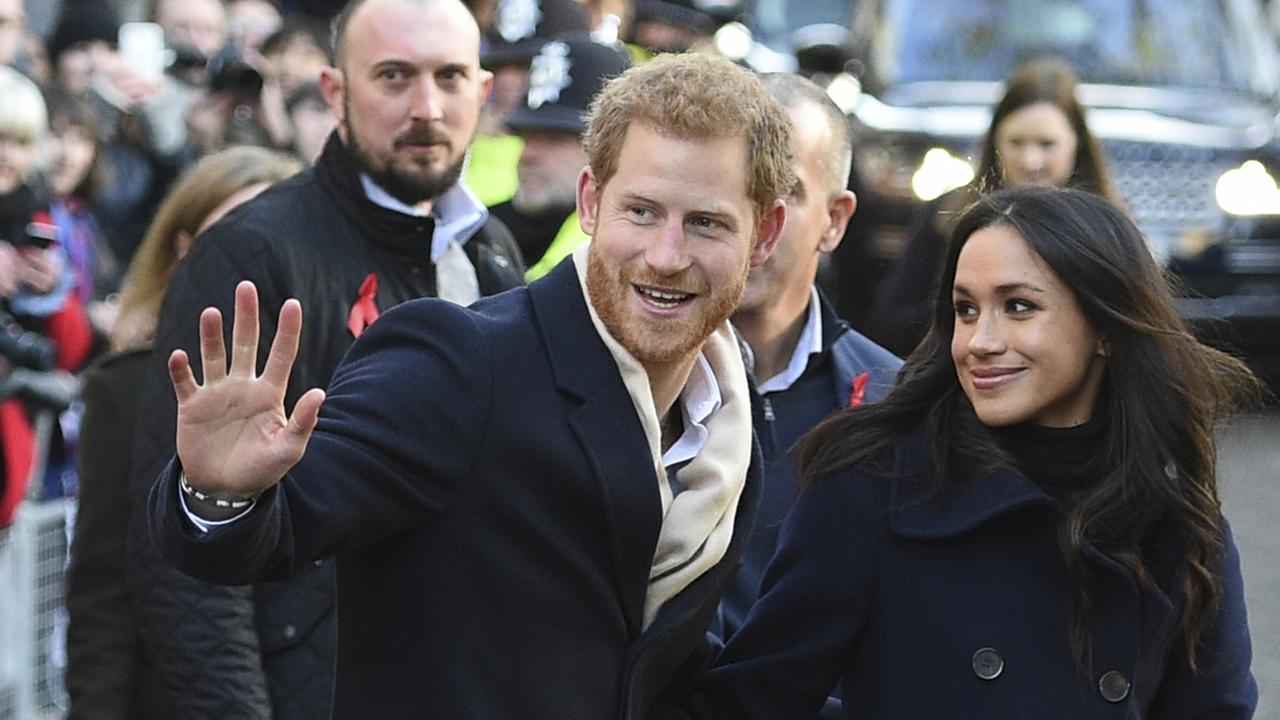 Prince Harry and Meghan Markle greet wellwishers on a walkabout in December. Picture: AFP/ Oli SCARFF