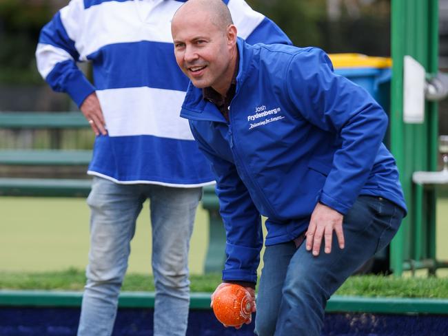 Josh Frydenberg plays lawn bowls while campaigning at Hawthorn Bowls Club Picture: Brendan Beckett