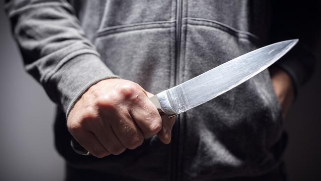 Generic crime Istock  -  Criminal with knife weapon threatening to stab