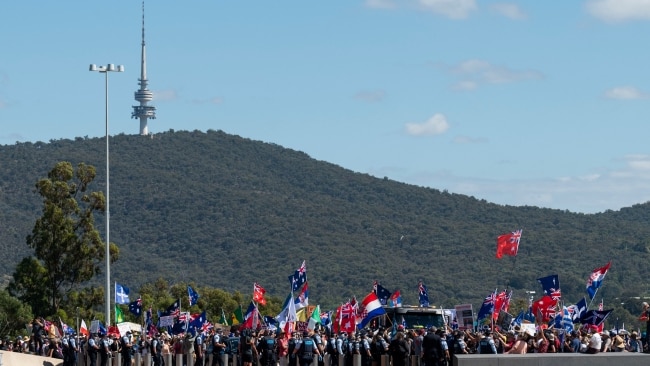 Police and protesters are seen in Canberra on Saturday. Picture : NCA NewsWire / Martin Ollman