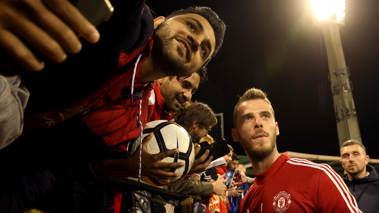 Manchester United goalkeeper David De Gea with fans at a training session at Perth’s WACA Ground last week. Picture: AAP