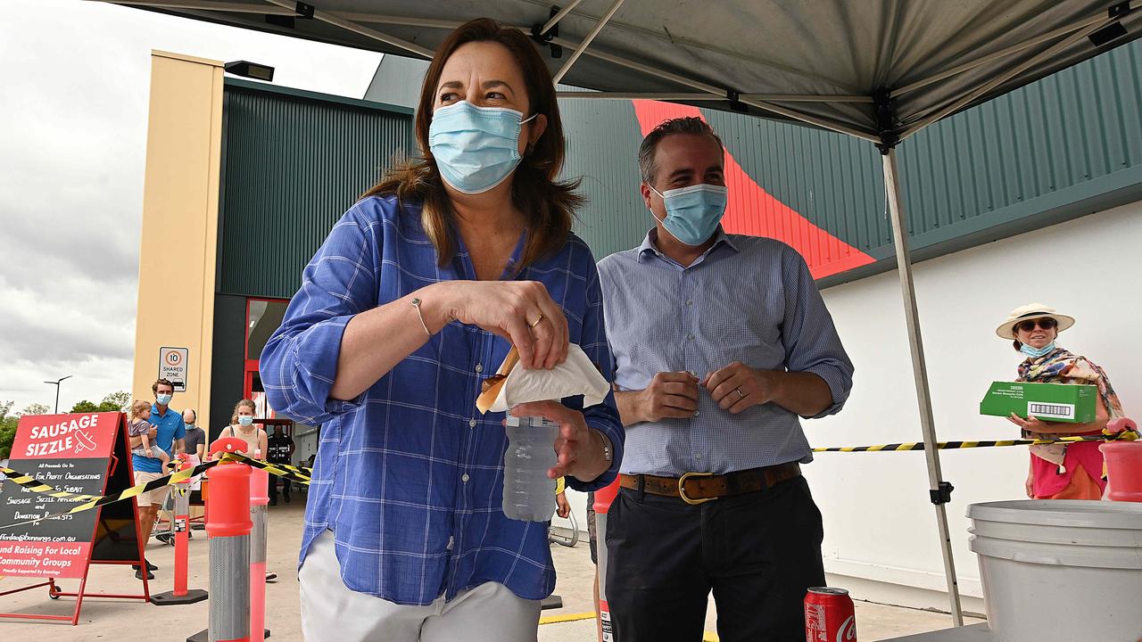 Annastacia Palaszczuk grabs a snag at Bunnings. Picture: Lyndon Mechielsen/Courier Mail