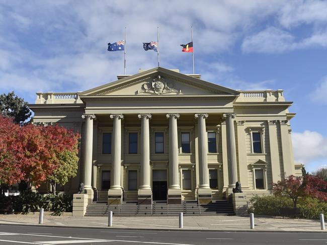 Flags flying half mast at City Hall. Marchers took part in an Anzac Parade through Malop Street to Johnstone Park on Anzac Day. Crowds lined the street but there were none of the usual formalities at the finale. Picture: Alan Barber