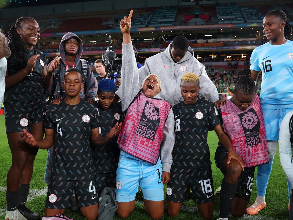 Reach for the stars: Nigeria players enter a huddle after their team advanced to the knockout stages in Brisbane. Picture: Elsa/Getty Images