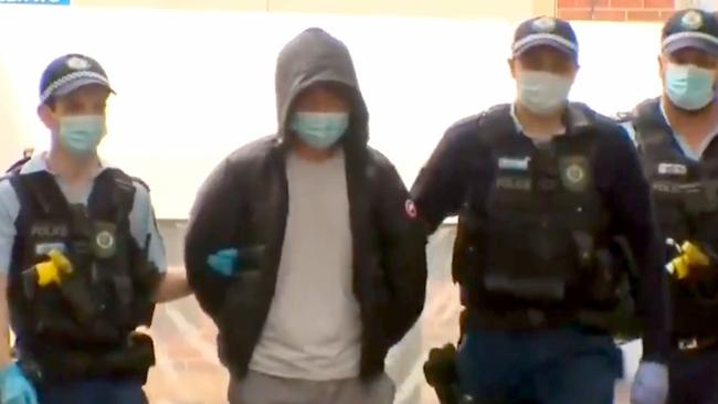 Mr Zhao (centre) will give evidence today as the trial continues into its second week. Picture: Supplied / 9News