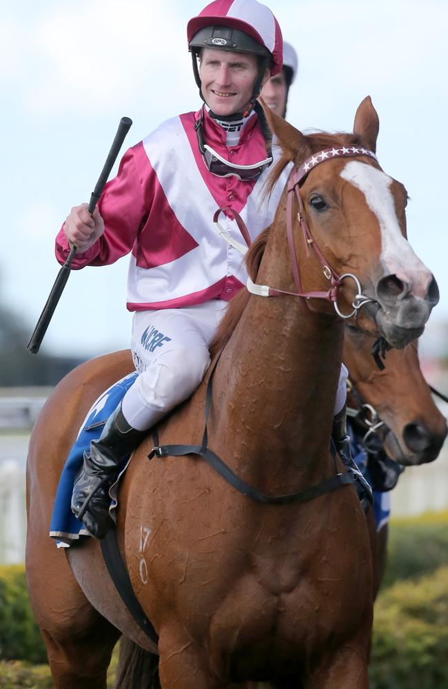 Real Love and jockey Brad Rawiller after tasting success during the Queensland winter. Picture: Jono Searle