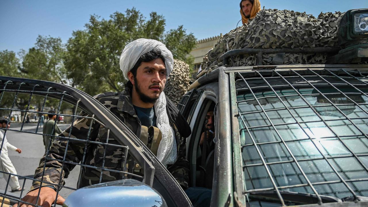 Taliban fighters stand guard along a street at the Massoud Square in Kabul. Picture: AFP