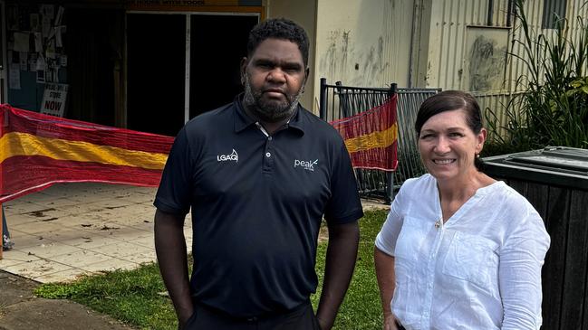 Wujal Wujal mayor Bradley Creek and Communities Minister Leanne Enoch stand outside the community store which was badly damaged during the Far North floods.