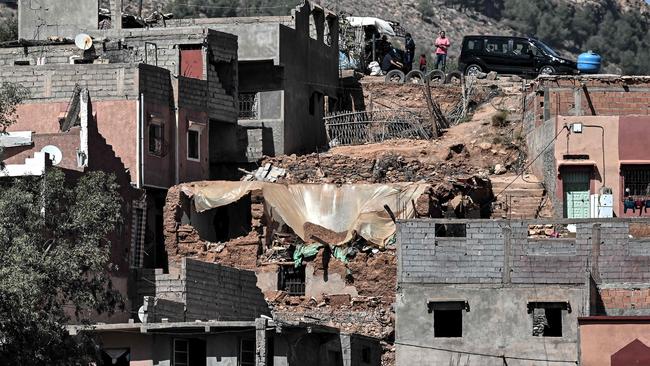 A man stands on a hill above buildings damaged by the September 8 earthquake in the village of Asni near Moulay Brahim in al-Haouz province. Picture: AFP